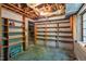 Unfinished basement storage room with shelving, and concrete walls at 803 Old Mill Rd, Chapel Hill, NC 27514