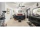 Dark bedroom with plush carpet and a sleek black dresser and desk at 8520 Quarton Dr, Raleigh, NC 27616
