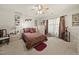 Spacious bedroom with plush carpet, decorative ceiling fan, and large bed at 8520 Quarton Dr, Raleigh, NC 27616
