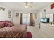 Bright bedroom with plush carpet, decorative ceiling fan, and lots of natural light at 8520 Quarton Dr, Raleigh, NC 27616