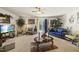 Bright living room featuring carpet, ceiling fan, and sliding doors leading to outdoor at 8520 Quarton Dr, Raleigh, NC 27616