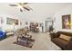 Open living room featuring neutral paint, plush seating, and seamless flow into the dining area at 8520 Quarton Dr, Raleigh, NC 27616