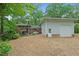 Home exterior highlighting a detached garage and spacious backyard, perfect for outdoor activities at 905 Cindy St, Cary, NC 27511