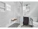 Modern bathroom featuring a glass shower, floating vanity, and gray hexagonal tiles at 905 Cindy St, Cary, NC 27511