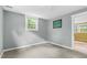 Cozy bedroom featuring neutral walls, carpet flooring, and a bright window at 905 Cindy St, Cary, NC 27511