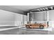 Garage featuring a car lift and ample space for car maintenance and storage at 905 Cindy St, Cary, NC 27511