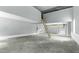 Spacious garage featuring tall ceilings, with a ladder leading to additional loft storage at 905 Cindy St, Cary, NC 27511