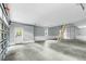 Large garage with a back door, a window, a ladder, and ample space for multiple vehicles or storage at 905 Cindy St, Cary, NC 27511