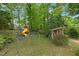 Backyard featuring a playset, jungle gym, and playhouse offering space for fun and adventure at 905 Cindy St, Cary, NC 27511