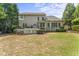 Beautifully landscaped backyard with a deck and lush greenery offers a serene outdoor space at 909 Grogans Mill Dr, Cary, NC 27519