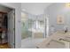 Modern bathroom featuring a glass-door shower, soaking tub, and walk-in closet at 909 Grogans Mill Dr, Cary, NC 27519