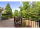 Enjoy outdoor living on this spacious deck, complete with lovely flower boxes and backyard views at 909 Grogans Mill Dr, Cary, NC 27519