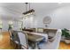 Elegant dining room features a long table, stylish chairs, and modern light fixture at 909 Grogans Mill Dr, Cary, NC 27519