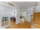 Foyer featuring hardwood floors, staircase, and an open view into the office space at 909 Grogans Mill Dr, Cary, NC 27519