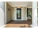 Close up of front door with beautiful glass, trim, and sidelights. The address is 909 at 909 Grogans Mill Dr, Cary, NC 27519