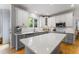 Well-equipped kitchen showcases a large island, modern appliances and bright lighting at 909 Grogans Mill Dr, Cary, NC 27519