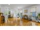 Open-concept living room and dining area with hardwood floors and natural light at 909 Grogans Mill Dr, Cary, NC 27519