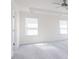 Light-filled bedroom features a ceiling fan, recessed lighting, and two bright windows with white blinds at 921 Kinglet House Rd, Knightdale, NC 27545