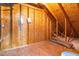 Unfinished attic area showing wooden supports and insulation at 112 Gadsbury Dr, Holly Springs, NC 27540