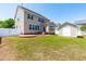 Lovely backyard with a well-maintained lawn and a storage shed at 112 Gadsbury Dr, Holly Springs, NC 27540