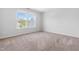 Bright bedroom with plush carpet and two windows providing natural light at 112 Gadsbury Dr, Holly Springs, NC 27540