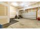 Spacious two-car garage with ample storage space and a sturdy workbench at 112 Gadsbury Dr, Holly Springs, NC 27540
