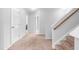 Upstairs hallway with plush carpet and neutral color palette at 112 Gadsbury Dr, Holly Springs, NC 27540