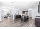 Spacious open concept kitchen with hardwood floors, stainless appliances, and center island at 112 Gadsbury Dr, Holly Springs, NC 27540