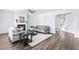 Living room with hardwood floors, a fireplace, neutral paint, and two sofas at 112 Gadsbury Dr, Holly Springs, NC 27540