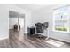 Bright office with hardwood floors and desk setup looking out a large window at 112 Gadsbury Dr, Holly Springs, NC 27540