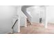Carpeted staircase with a wooden handrail and neutral walls at 112 Gadsbury Dr, Holly Springs, NC 27540