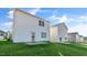 Expansive backyard featuring a walk-out patio and plush green grass at 112 Global Ave, Fuquay Varina, NC 27526