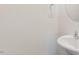 Bathroom area featuring white sink and a mirror at 112 Global Ave, Fuquay Varina, NC 27526