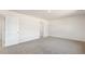 Bedroom featuring wall-to-wall carpet, neutral paint, and a large window at 112 Global Ave, Fuquay Varina, NC 27526