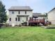 Spacious backyard featuring well-kept lawn, a wooden deck, and custom-built garden plot at 113 Chesterfield Dr, Cary, NC 27513