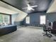 Spacious bedroom with a dark ceiling, blue walls, a ceiling fan, and two windows at 113 Chesterfield Dr, Cary, NC 27513