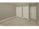 Neutral bedroom with carpet and multiple closets at 113 Chesterfield Dr, Cary, NC 27513