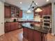 Spacious kitchen featuring an island, granite countertops, stainless steel appliances, and ample cabinetry at 113 Chesterfield Dr, Cary, NC 27513