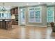 Bright and open kitchen flows into a dining area, offering ample natural light through large windows at 113 Chesterfield Dr, Cary, NC 27513