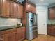 Kitchen showing stainless steel refrigerator and ample counter space at 113 Chesterfield Dr, Cary, NC 27513