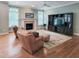 Inviting living room featuring a fireplace, entertainment center, and cozy seating, perfect for relaxation at 113 Chesterfield Dr, Cary, NC 27513