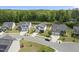 Aerial view of neighborhood homes including a lake in the background at 115 Zulabelle Ct, Garner, NC 27529