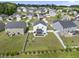 Aerial view of fenced in backyard with patio and nice homes at 115 Zulabelle Ct, Garner, NC 27529