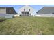 Spacious backyard featuring a white fence and screened porch with adjacent houses at 115 Zulabelle Ct, Garner, NC 27529