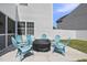 Back patio area with outdoor seating surrounding a firepit at 115 Zulabelle Ct, Garner, NC 27529