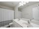 Bathroom featuring double sinks, a large mirror, and a shower-tub combination at 115 Zulabelle Ct, Garner, NC 27529