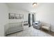 Charming Bedroom with neutral colors, a crib, and a cozy rocking chair at 115 Zulabelle Ct, Garner, NC 27529