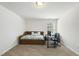 Multi-purpose bedroom with a cozy daybed, a functional desk, and a window that invites natural light at 115 Zulabelle Ct, Garner, NC 27529