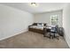 Versatile bedroom with a cozy daybed, a functional desk, and a window that invites natural light at 115 Zulabelle Ct, Garner, NC 27529