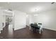 Bright dining room featuring dark wood flooring and a stylish light fixture at 115 Zulabelle Ct, Garner, NC 27529